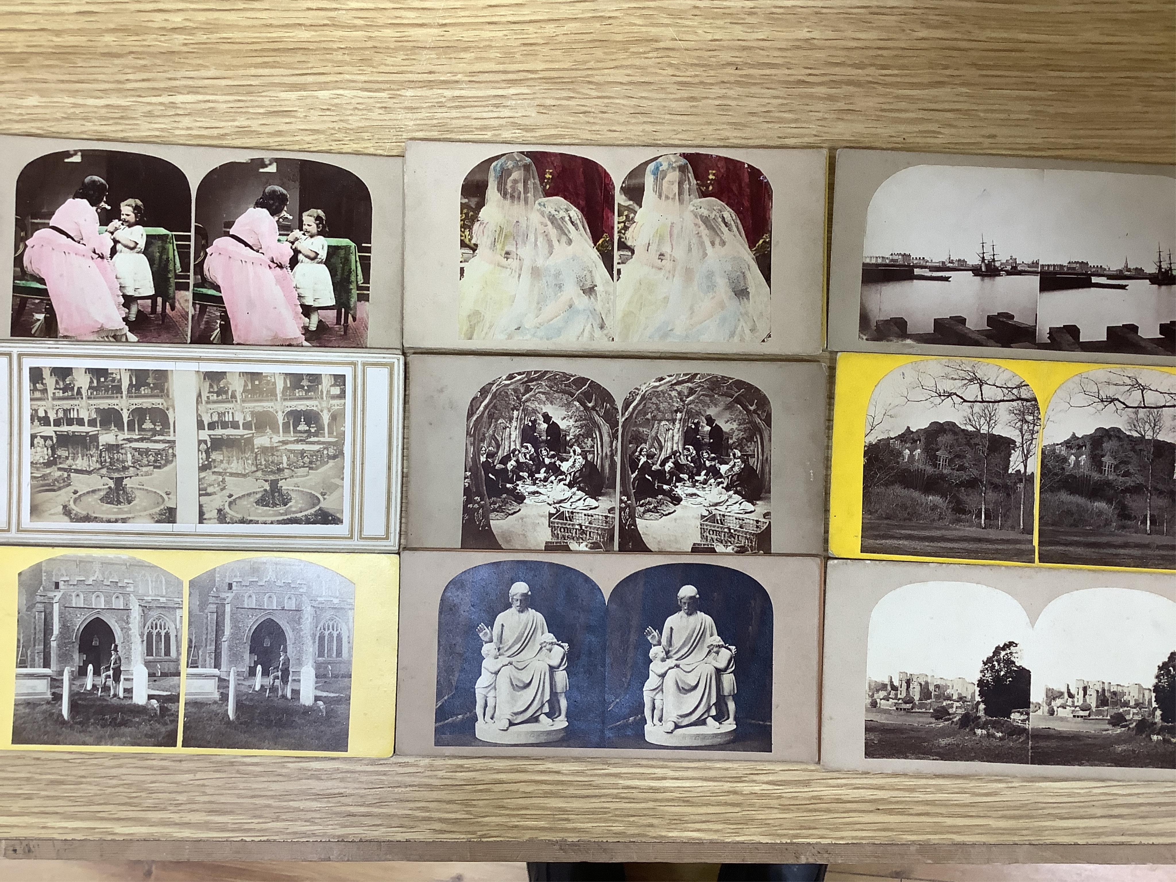 A late 19th century cased stereoscopic viewer together with topographical and other cards. Condition - fair
